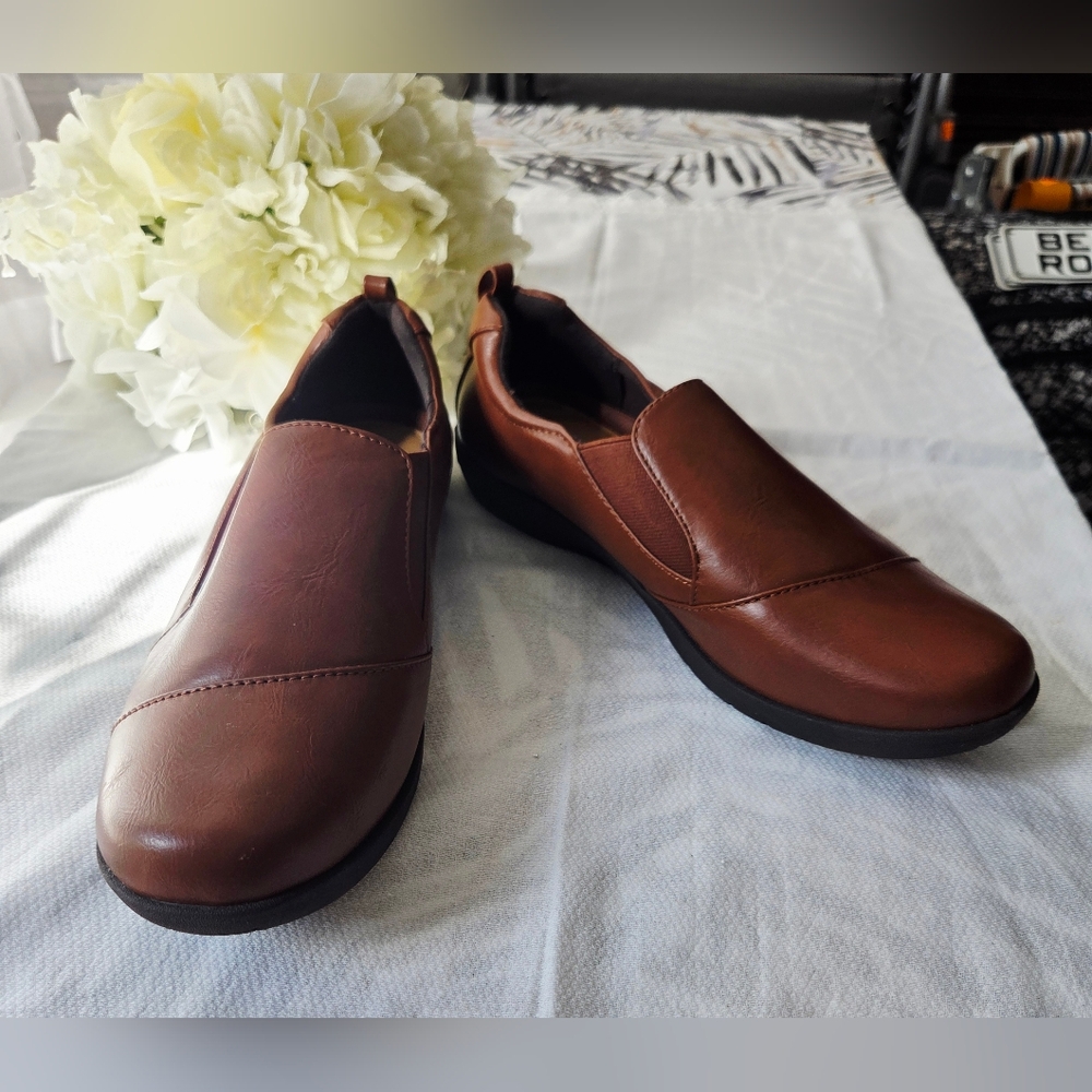 Pair of clog- or moccasin-style slippers from the Confortview brand